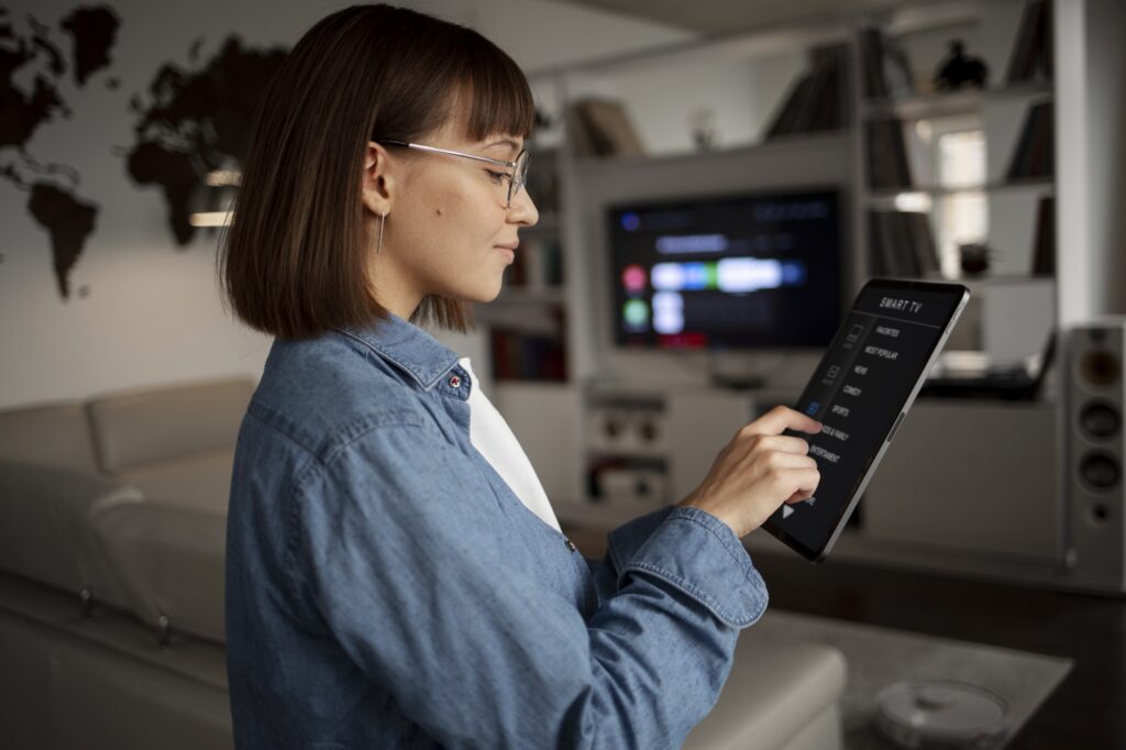 woman using home automation in a villa